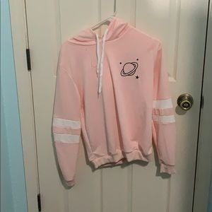 Pink sweater with planet